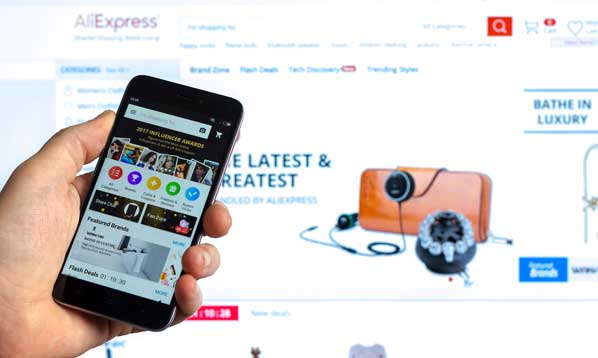 Customer shopping on his at phone at AliExpress