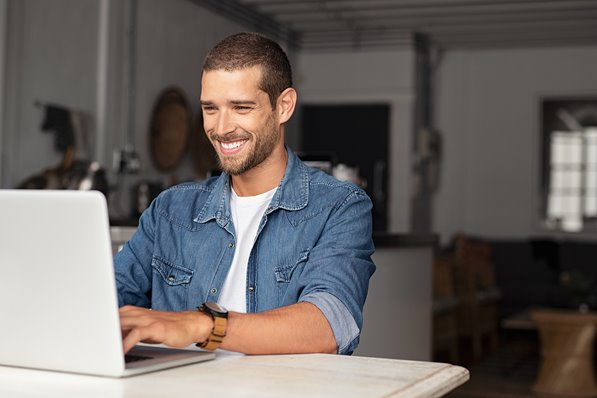 Man playing games on laptop