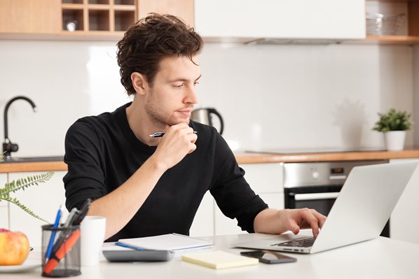 Remote worker on laptop at home