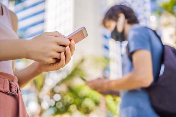 People reading SMS messages during COVID pandemic
