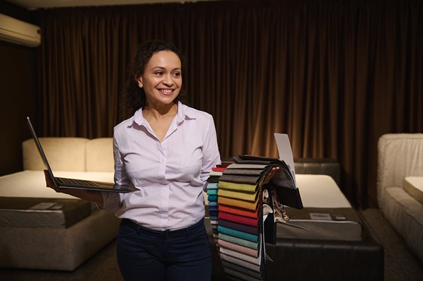 Fabric store owner with her laptop