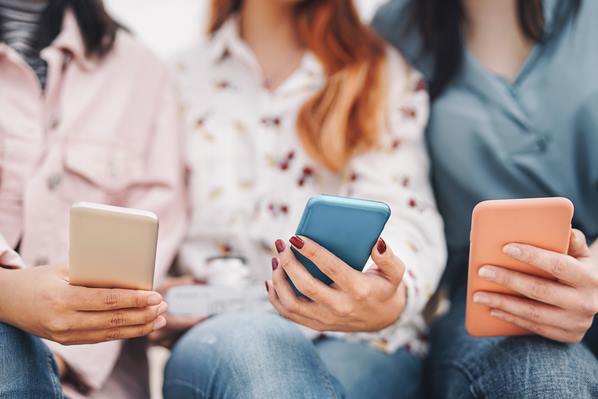 Group of people looking at smartphones
