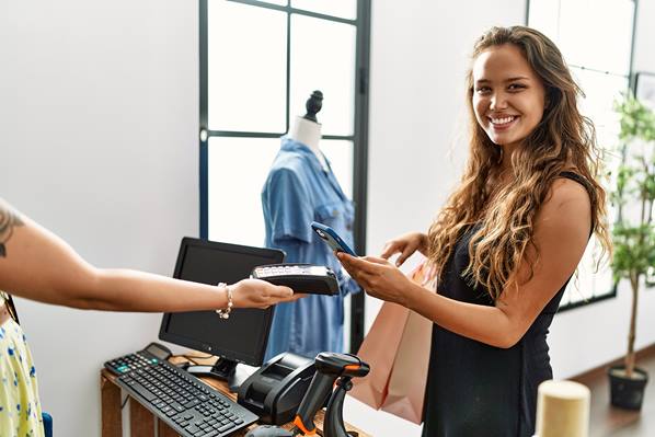 Customer paying with mobile phone in store