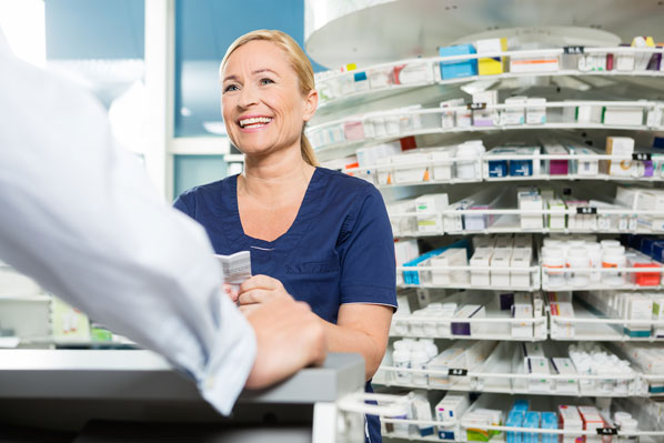 Chemist serving customer