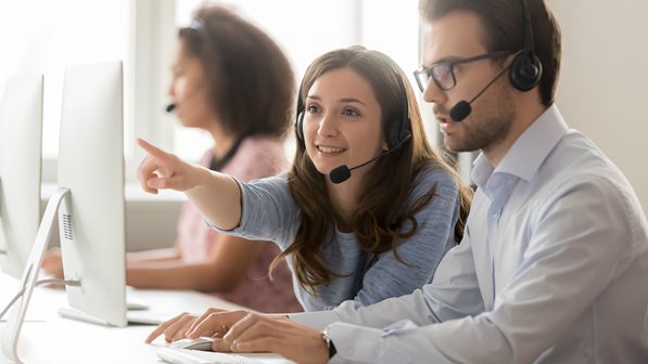 Customer Service Reps looking at dashboard
