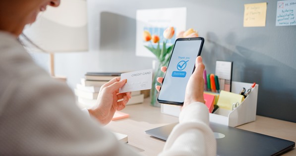 Customer using mobile phone to make a payment