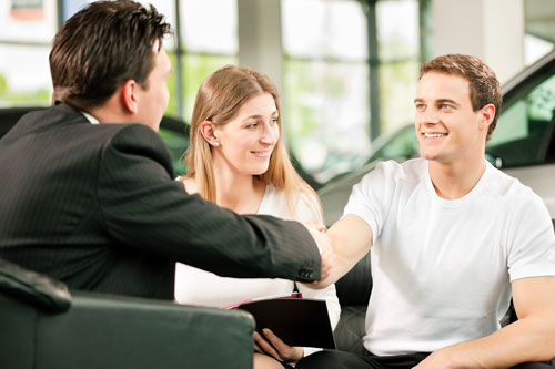 Customers shaking hands with supplier