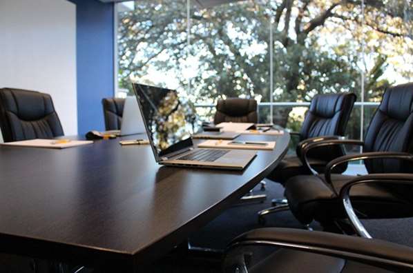 Meeting room with laptop on table