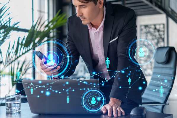 Customer experience executive with phone and laptop