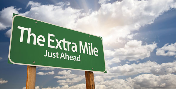 Going the extra mile signpost