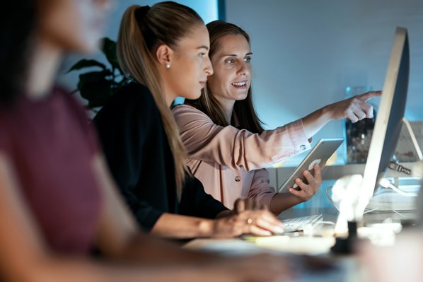 IT Team looking at computer screens