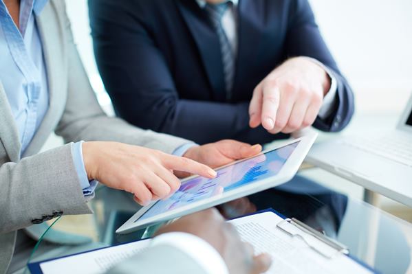 Business meeting with tablet