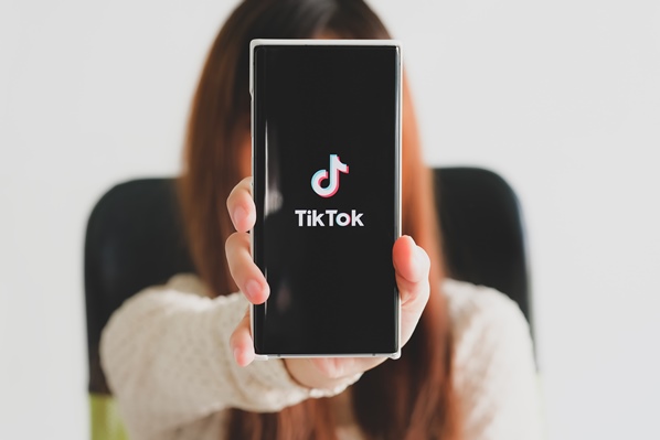 Women looking at TikTok on her phone