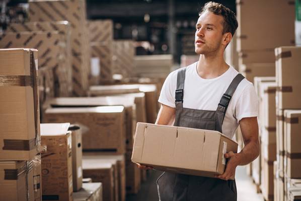 Man carrying customer's order in a box