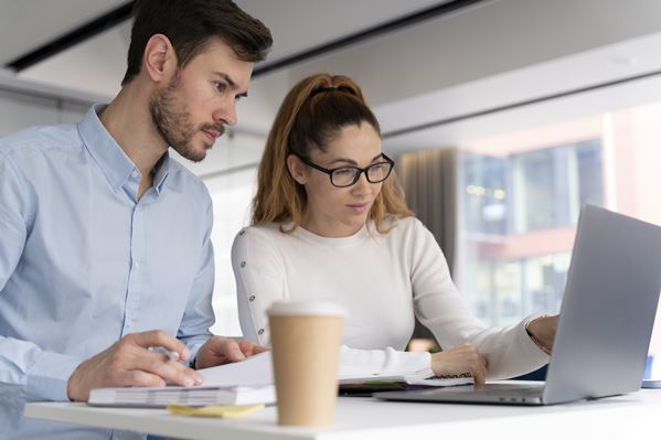 HR Managers working on laptop