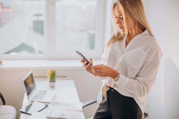 Businessperson using social media on phone 
