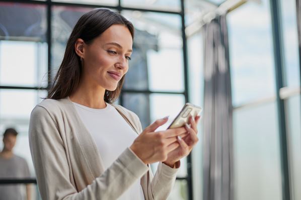 Women looking at text message on her phone