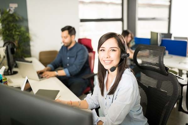 Customer support agent talking on phone