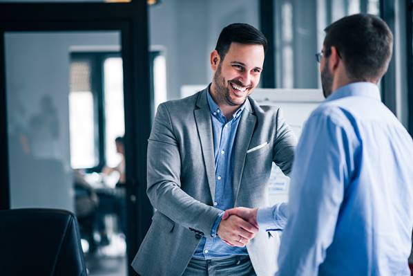 Business managers shaking hands