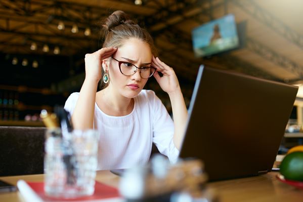 Unhappy customer working on laptop