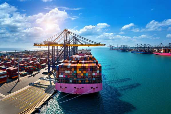 Shipping containers being loaded on to a boat