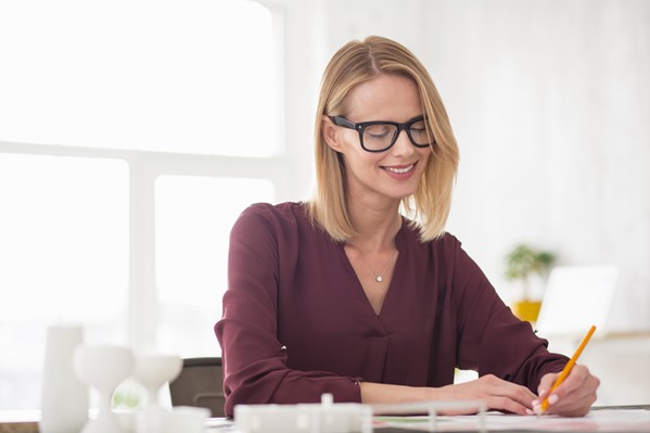 Customer service professional writing her resume