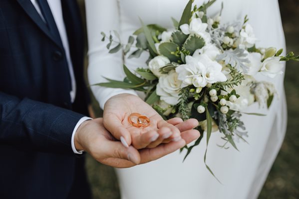 Newly married couple with wedding rings