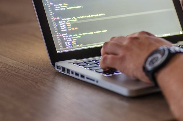 Computer coding on laptop