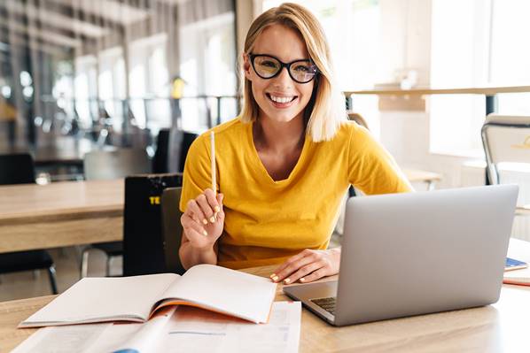 Business writer working on laptop